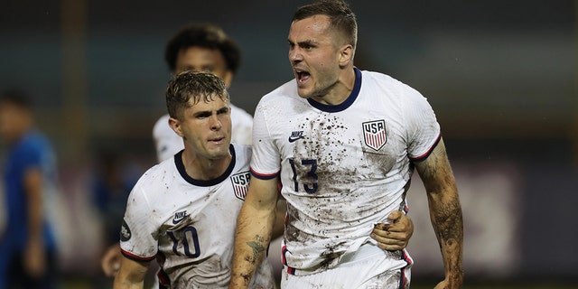 Jordan Morris #13 of the United States celebrates scoring a goal with teammate Christian Pulisic #10 during a Concacaf Nations League game between El Salvador and the United States at Estadio Cuscatlan on June 14, 2022 in San Salvador, El Salvador.