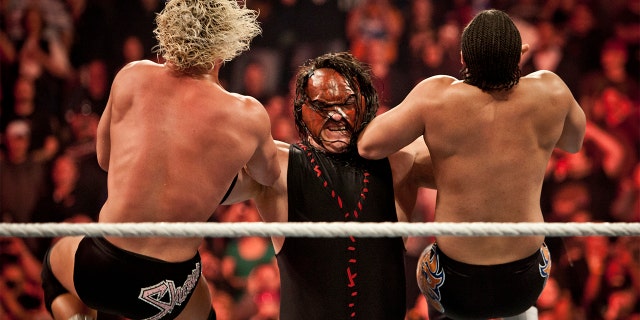 Kane, taking two top stars down during the WWE Raw event at Rose Garden arena in Portland, Oregon, Feb. 27, 2012.