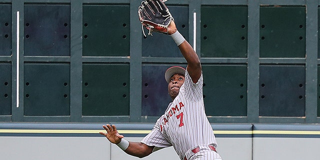 Kendall Pettis of the Oklahoma Sooners makes a running catch in the third inning against the LSU Tigers during the Shriners Children's College Classic at Minute Maid Park March 4, 2022, in Houston.