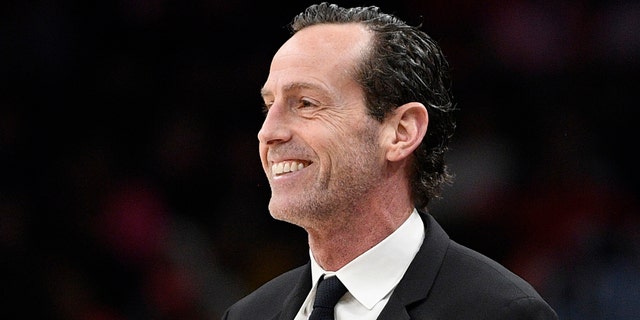 File-Brooklyn Nets coach Kenny Atkinson is watching the first half of the team's NBA basketball match against the Washington Wizards on February 1, 2020 in Washington.