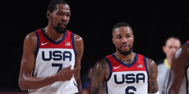 Kevin Durant (7) of the United States talks with Damian Lillard (6) during a men's basketball semifinal between the United States and Australia at the Tokyo 2020 Olympic Games in Saitama, Japan, Aug. 5, 2021.