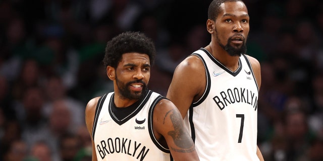 Kyrie Irving (11) and Kevin Durant (7) of the Brooklyn Nets during the first quarter of Game 1 of the 2022 NBA Eastern Conference first round playoffs against the Boston Celtics at TD Garden April 17, 2022, in Boston.