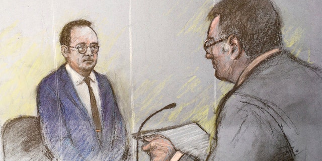 This is a court artist sketch by Elizabeth Cook of actor Kevin Spacey, left, in the dock at Westminster Magistrates Court in London, Thursday June 16, 2022.