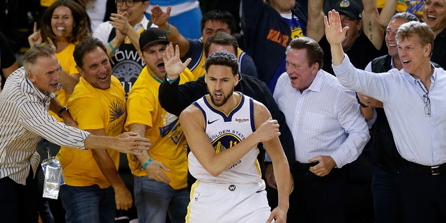 Klay Thompson of the Golden State Warriors celebrates with fans during the Western Conference semifinals of the NBA playoffs against the Houston Rockets on May 8, 2019, in Oakland, California.