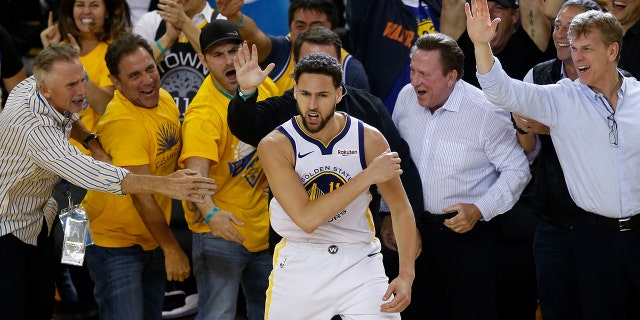 Klay Thompson of the Golden State Warriors celebrates with fans during the Western Conference semifinals of the NBA playoffs against the Houston Rockets on May 8, 2019, in Oakland, California.