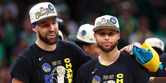  Stephen Curry #30 and Klay Thompson #11 of the Golden State Warriors celebrate after defeating the Boston Celtics 103-90 in Game Six of the 2022 NBA Finals at TD Garden on June 16, 2022 in Boston, Massachusetts.