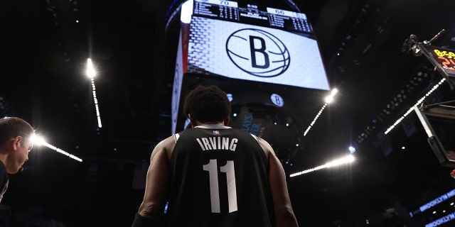 Kyrie Irving #11 of the Brooklyn Nets in action against the Charlotte Hornets at Barclays Center on March 27, 2022 in New York City.