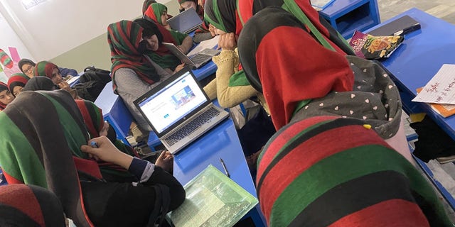 Girls studying at an undisclosed location in Afghanistan.