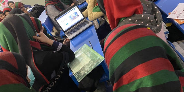 Girls studying at an undisclosed location in Afghanistan.