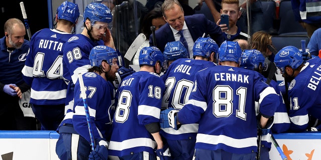 Head coach Jon Cooper of the Tampa Bay Lightning talks with the team during a break in play against the New York Rangers during the third period in Game Four of the Eastern Conference Final of the 2022 Stanley Cup Playoffs at Amalie Arena on June 07, 2022 in Tampa, Florida.