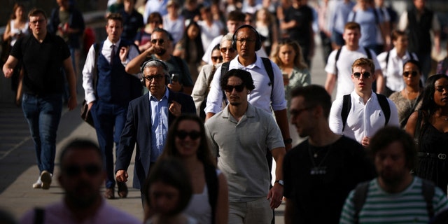 Commuters will cross the London Bridge on June 17, 2022 during the warm climate of London. 