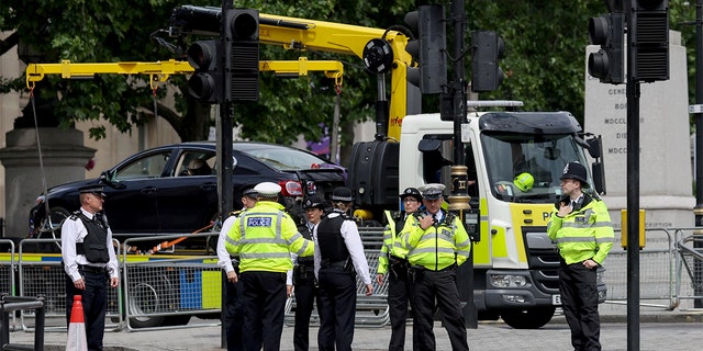 A police vehicle removes a car following a security incident near Trafalgar Square, as Queen Elizabeth's Platinum Jubilee celebrations continue, in London, June 4, 2022.