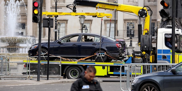 A police vehicle removes a car following a security incident near Trafalgar Square, as Queen Elizabeth's Platinum Jubilee celebrations continue, in London, June 4, 2022. 