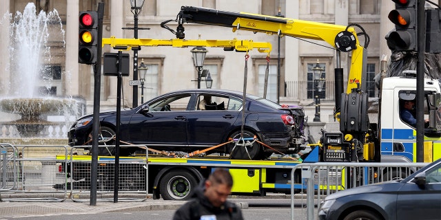A police vehicle removes a car following a security incident near Trafalgar Square, as Queen Elizabeth's Platinum Jubilee celebrations continue, in London, June 4, 2022.