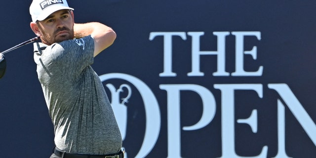 South Africa's Louis Oosthuizen plays his shot from the 1st tee during his final round on day 4 of The 149th British Open Golf Championship at Royal St George's, Sandwich in south-east England on July 18, 2021.