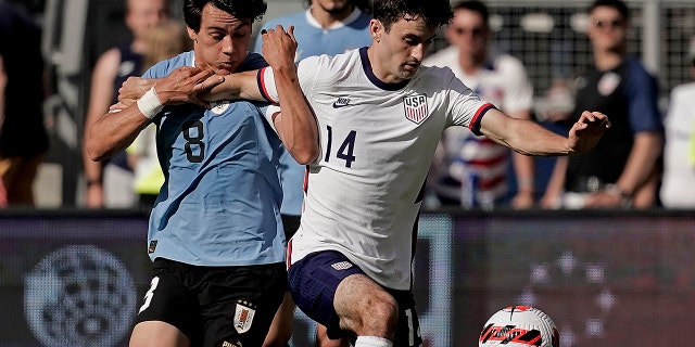 Uruguay forward Facundo Pellistri and USA midfielder Luca de la Torre chase the ball Sunday, June 5, 2022, in Kansas City.