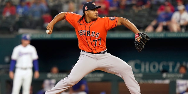Houston Astros starting pitcher Luis Garcia throws during the first inning of a baseball game against the Texas Rangers in Arlington, Texas, Wednesday, June 15, 2022.