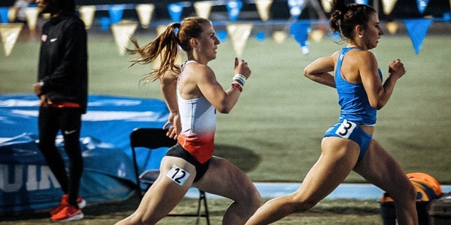 Madisan DeBos (center) at the Bob Larsen Invite at UCLA, March 2022. 