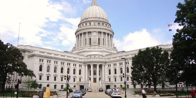 The Wisconsin State Capitol, in Madison, Wisconsin, houses both chambers of the Wisconsin legislature along with the Wisconsin Supreme Court and the Office of the Governor. 