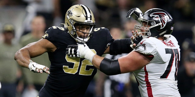 New Orleans Saints defensive end Marcus Davenport (92) is blocked by Atlanta Falcons offensive tackle Jake Matthews (70) during the second half at the Caesars Superdome in New Orleans Nov. 7, 2021.