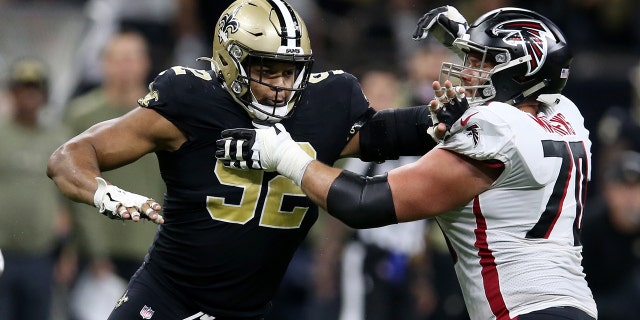 New Orleans Saints defensive end Marcus Davenport (92) is blocked by Atlanta Falcons offensive tackle Jake Matthews (70) during the second half at the Caesars Superdome in New Orleans Nov. 7, 2021.