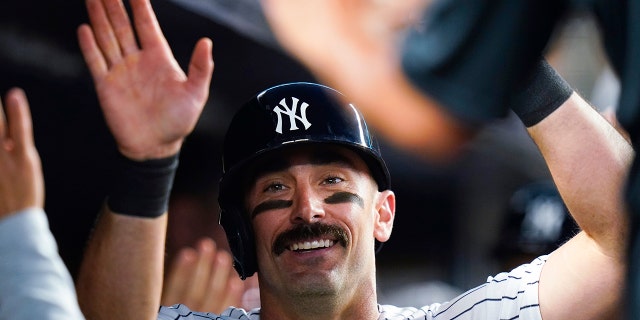 The New York Yankees' Matt Carpenter is congratulated in the dugout after hitting a two-run home run during the fifth inning of the team's game against the Detroit Tigers Friday, June 3, 2022, in New York.