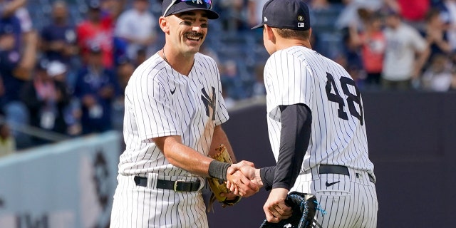 New York Yankees' Matt Carpenter, left, celebrates with Anthony Rizzo (48) after they defeated the Chicago Cubs in a baseball game, Sunday, June 12, 2022, in New York.
