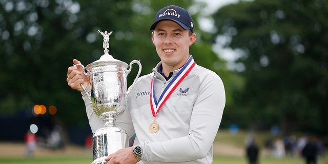 England's Matt Fitzpatrick celebrates with the US Open Championship trophy after winning the final round of the 122nd US Open Championship at The Country Club on June 19, 2022 in Brookline, Massachusetts.