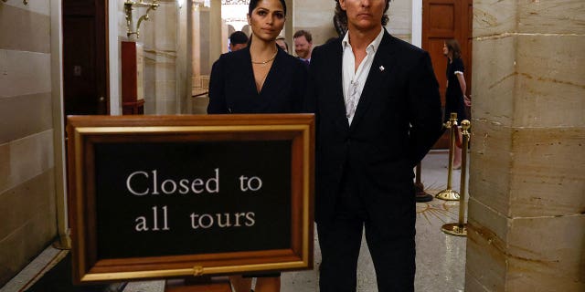 Actor Matthew McConaughey and his wife Camila Alves McConaughey walk between meetings with lawmakers about gun policy after the recent mass shooting at Robb Elementary School in his hometown of Uvalde, Texas, at the U.S. Capitol in Washington, June 7, 2022. 