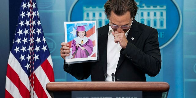Actor Matthew McConaughey, a native of Uvalde, Texas as well as a father and a gun owner, becomes emotional as he holds up a picture of 10-year-old victim Alithia Ramirez as he speaks to reporters about the school shooting in Uvalde during a press briefing at the White House in Washington, US, June 7, 2022. 