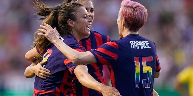 U.S. defender Sofia Huerta, left, forward Alex Morgan, rear, and forward Megan Rapinoe (15) celebrate after a first-half goal against Colombia during an international friendly soccer match Tuesday, June 28, 2022, in Sandy, Utah.