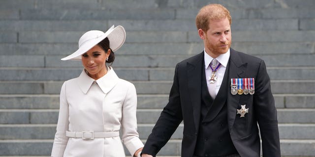 Meghan, Duchess of Sussex and Prince Harry, Duke of Sussex depart the National Service of Thanksgiving at St Paul's Cathedral on June 03, 2022, in London, England.