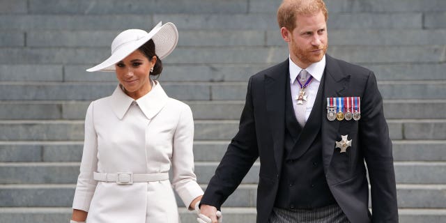 Meghan, Duchess of Sussex and Prince Harry, Duke of Sussex depart the National Service of Thanksgiving at St Paul's Cathedral on June 03, 2022, in London, England.