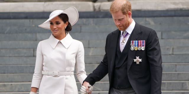 Meghan, Duchess of Sussex and Prince Harry, Duke of Sussex depart the National Service of Thanksgiving at St Paul's Cathedral.