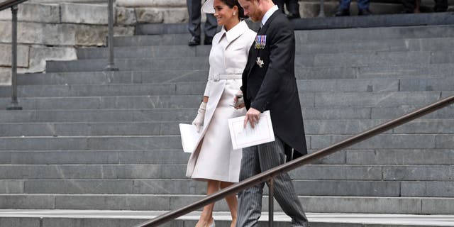 The Duchess and Duke of Sussex leave the National Service of Thanksgiving at St Paul's Cathedral.
