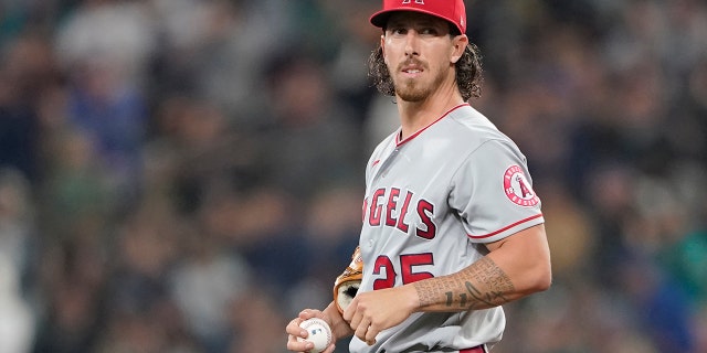 Los Angeles Angels starting pitcher Michael Lorenzen stands on the mound after he gave up a solo home run to Seattle Mariners' Cal Raleigh during the second inning of a baseball game, Friday, June 17, 2022, in Seattle. 