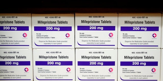 FILE - Boxes of the drug mifepristone line a shelf at the West Alabama Women's Center in Tuscaloosa, Ala., on Wednesday, March 16, 2022. 