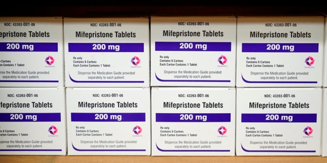 File-Wednesday, March 16, 2022, Mifepristone boxes are lined up on the shelves of the West Alabama Women's Center in Tuscaloosa, Alabama. 