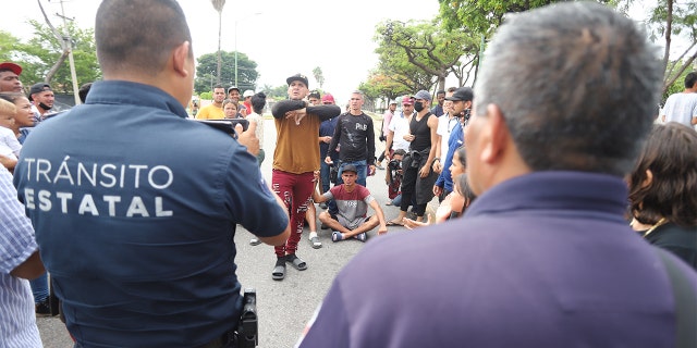 Police take measures as migrants gather around National Migration Institute in Tuxtla Gutierrez, Mexico on June 10, 2022.