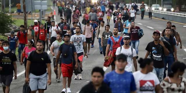 Migrants walk on the road at the migrant caravan in Huixtla, Chiapas, in Mexico on June 9, 2022. The caravan from Huixtla to Mapastepec restarted with an approximate contingent of 3,000 migrants. 