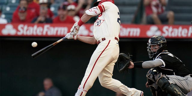 Los Angeles Angels' Mike Trout hits an RBI double against the Chicago White Sox during the first inning of a baseball game Wednesday, June 29, 2022, in Anaheim, Calif.