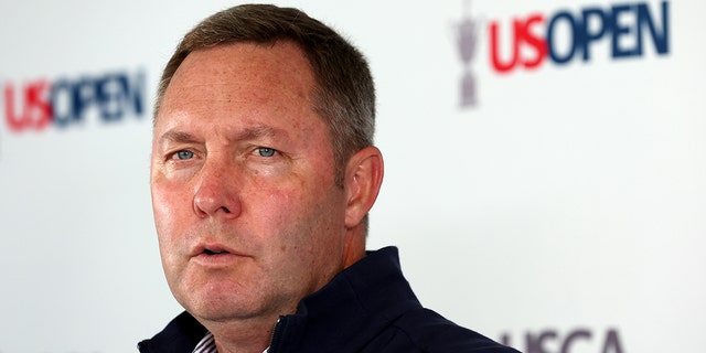 Mike Whan, CEO of the USGA, speaks to the media at a press conference during a practice round prior to the 122nd U.S. Open Championship at The Country Club on June 15, 2022 in Brookline, Massachusetts.