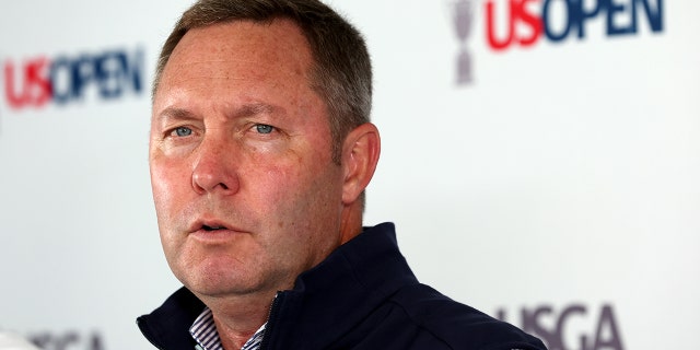 Mike Whan, CEO of the USGA, speaks to the media at a press conference during a practice round prior to the 122nd U.S. Open Championship at The Country Club on June 15, 2022 in Brookline, Massachusetts.