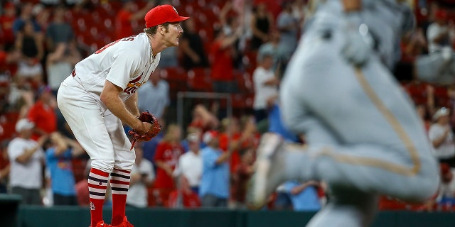 Cardinals starting pitcher Miles Mikolas watches as his no-hitter is broken up by a ground-rule double by Pittsburgh Pirates' Cal Mitchell Tuesday, June 14, 2022, in St. Louis.