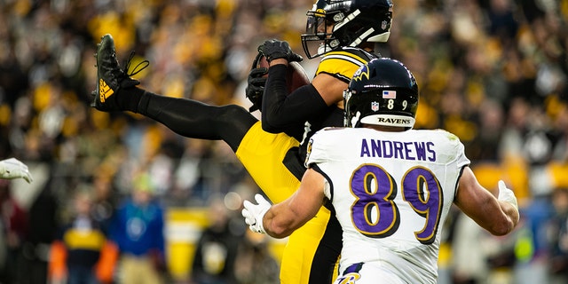 Pittsburgh Steelers free safety Minkah Fitzpatrick (39) intercepts a pass intended for Baltimore Ravens tight end Mark Andrews (89) during a game Dec. 5, 2021, at Heinz Field in Pittsburgh.