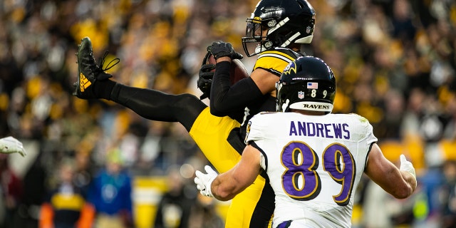 Pittsburgh Steelers free safety Minkah Fitzpatrick (39) intercepts a pass intended for Baltimore Ravens tight end Mark Andrews (89) during a game Dec. 5, 2021, at Heinz Field in Pittsburgh.