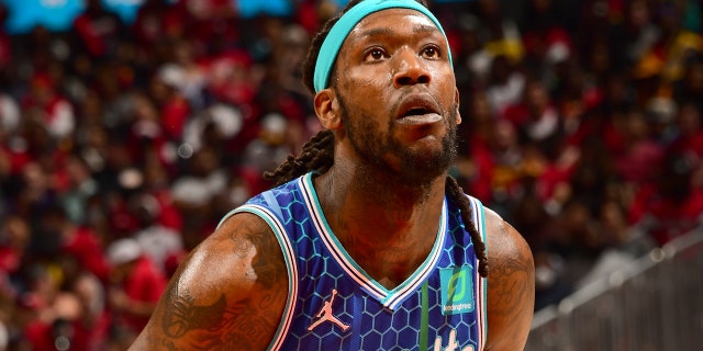 Montrezl Harrell #8 of the Charlotte Hornets prepares to shoot a free throw during the game against the Atlanta Hawks during the 2022 Play-In Tournament on April 13, 2022 at State Farm Arena in Atlanta, Georgia.