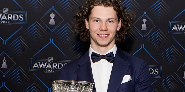 Moritz Cedar of the Detroit Red Wings poses with the Calder Trophy after the NHL Hockey Awards on Tuesday, June 21, 2022 in Tampa, Fla.  The Calder Trophy is awarded annually to the league's top rookie. 