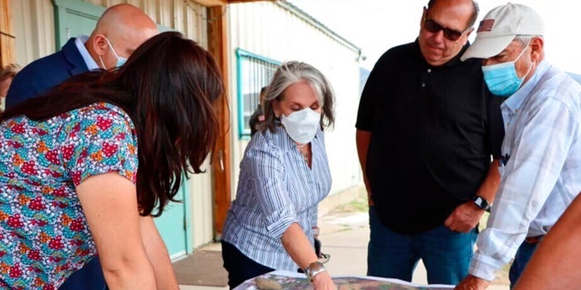 New Mexico's Gov. Michelle Lujan Grisham meets with local officials on wildfire damage in Mora County, June 7, 2022.