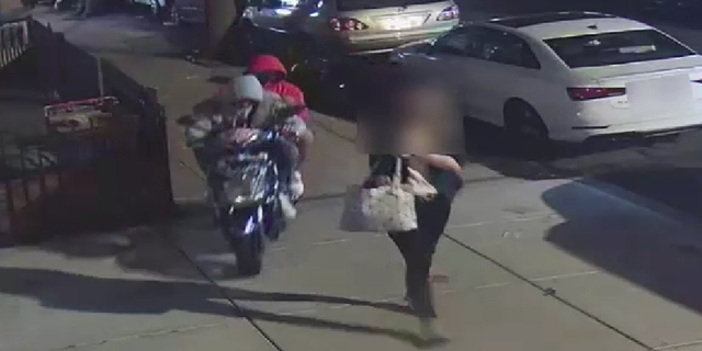The suspects are first seen approaching the woman from behind on a moped.